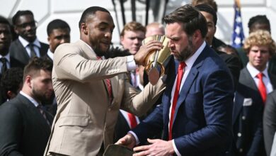 JD Vance mocked as he fumbles giant national championship trophy at White House celebration